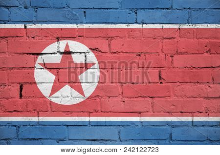 North Korea Flag Is Painted Onto An Old Brick Wall