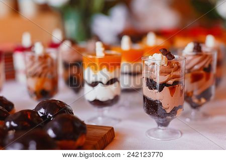 Candy Bar. Delicious Sweet Buffet With Cupcakes. Sweet Holiday Buffet With Cupcakes And Other Desser