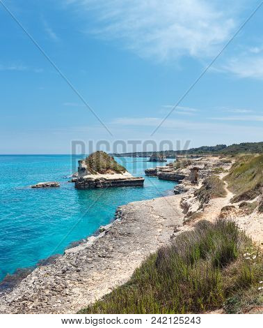 Picturesque Seascape With White Rocky Cliffs, Sea Bay And Islets At Grotta Dello Mbruficu, Salento A