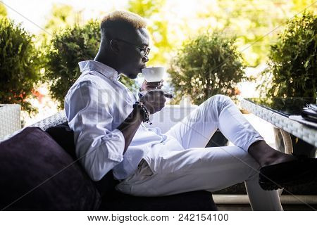 Young Handsome Business African American Man Drinking Coffee In Cafe
