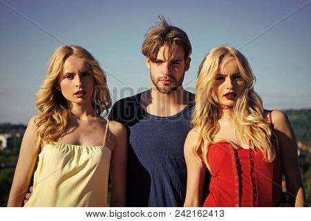 Twins Women With Macho On Blue Sky Background. Man With Beard With Twins, Relations. Family Trust, P