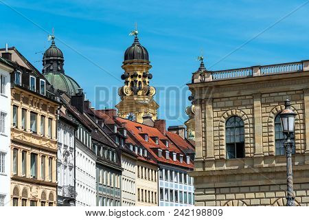 Old Houses In Downtown Munich With The Theatine Church In The Back