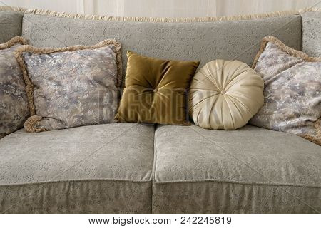 Velvet Pillows On Grey Sofa In Room