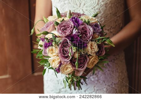 Young Beautiful Bride In White Dress Holding Wedding Bouquet, Bouquet Of Bride From Rose Cream Spray