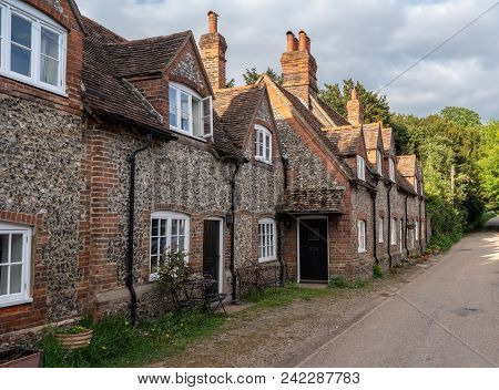 Street Of Brick Homes And Houses In The Chilterns Village Of Hambleden In Buckinghamshire