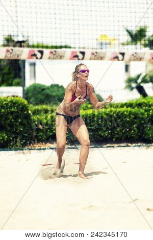 Ostia, Italy. May 27, 2015: Woman Serve Receive The Ball During  A Beachvolley Match Between Friends