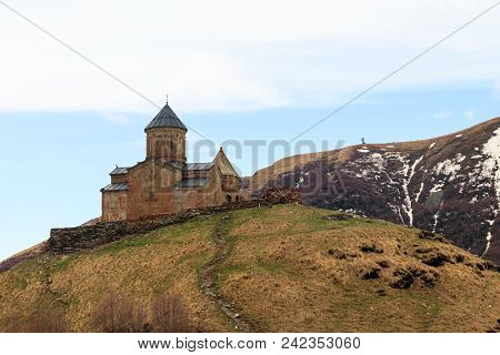 Gergeti Trinity Church (tsminda Sameba), Holy Trinity Church Near The Village Of Gergeti In Caucasia