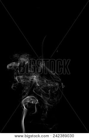 Movement Of White Smoke Isolated On Black Background.