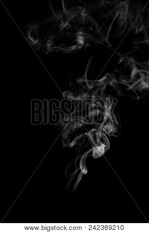 Movement Of White Smoke Isolated On Black Background.