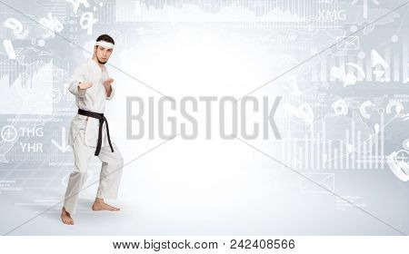 Young karate trainer doing karate tricks on the top of a metropolitan city