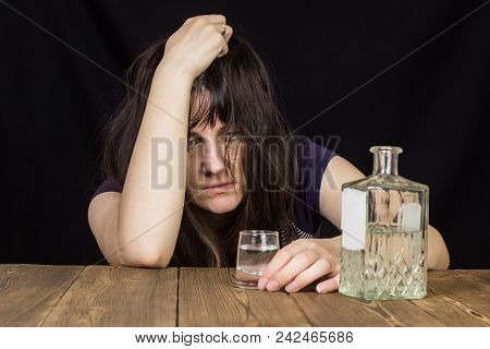 Drunk Girl With A Shot Of Alcohol And A Bottle Of Alcohol, Black Background, Wooden Table, Female Al
