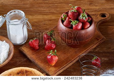 Recipe For Strawberry Pie, Fresh Strawberries, Flour And Sugar For Cooking Cake In Clay Bowl On Wood