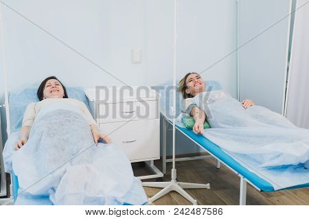 Female Patient Resting In Medical Bed At The Hospital Ward.