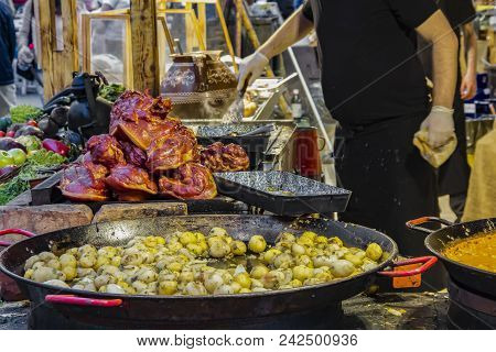 Traditional Hungarian Foods (stewed Vegetables And Meat, Goulash, Ham, Flat Cake And Sausages) At A 