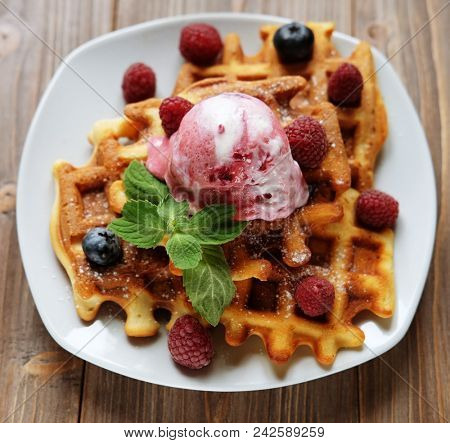 Belgian waffles with fresh berries and ice cream 