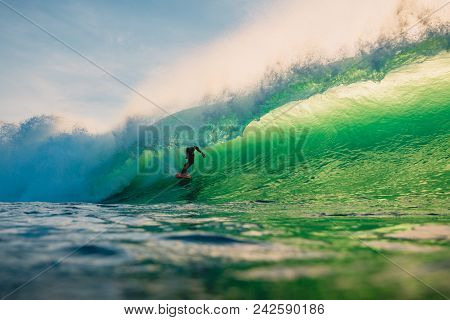 April 23, 2018. Bali, Indonesia. Surfer Ride On Big Barrel Wave At Padang Padang. Professional Surfi