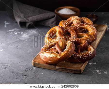 Freshly Baked Homemade Soft Pretzel With Salt On Rustic Table. Perfect For Octoberfest.