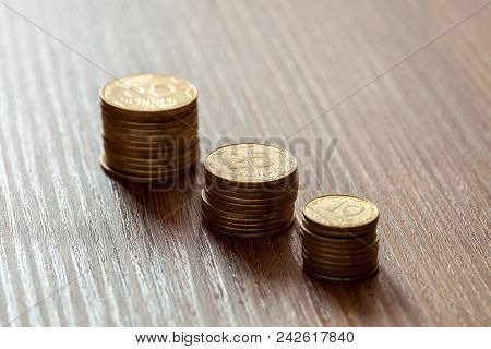 Kopeks The Ukrainian Currency, Coins On A Wooden Table.