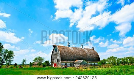 An Old Abandoned Barn Sits Decaying On An Empty Farm In Northern Minnesota.