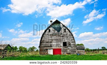 An Old Abandoned Barn Sits Decaying On An Empty Farm In Northern Minnesota.