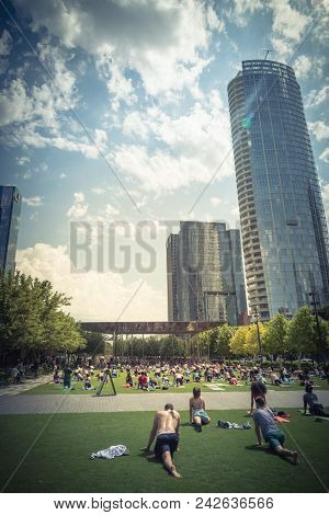 Diverse Group Of People Participating Free Public Yoga Class At Klyde Park, Dallas