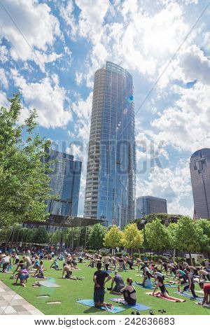 Diverse Group Of People Participating Free Public Yoga Class At Klyde Park, Dallas