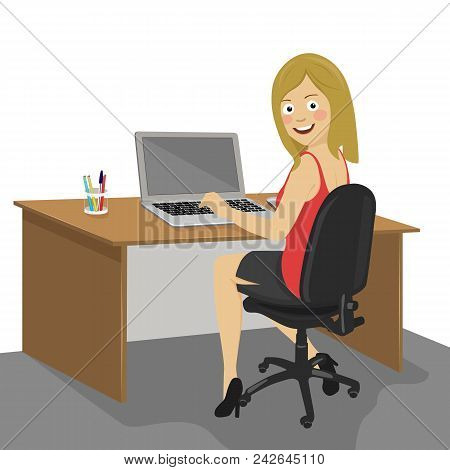 Young Happy Female Ofiice Worker Looking Over Shoulder Working On A Laptop Sitting At The Desk