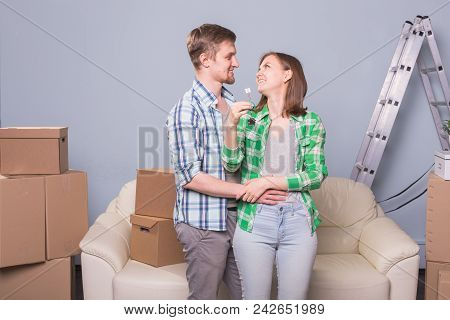 Beautiful Family With Boxes And Holding Flat Keys