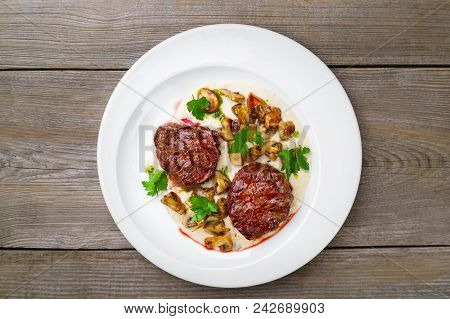 Delicious Grilled Beef Steaks With Mushrooms On White Plate, Flat Lay. Appetizing Roasted Meat, Gour