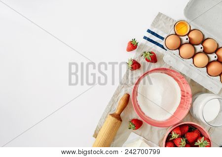 Set Ingredients For Cooking Strawberry Pie Or Cake On White Background With Border. Flat Lay, Top Vi