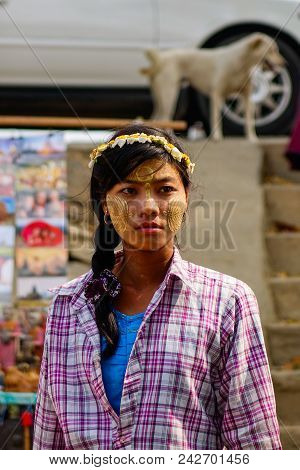 A Burmese Woman With Thanaka Paste