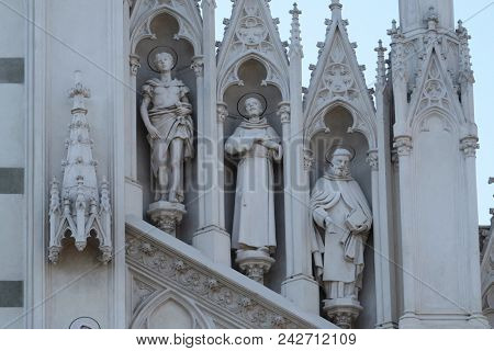 ROME, ITALY - SEPTEMBER 02: Statues of St. Victor, Francis of Assisi and Nicholas of Tolentino on the facade of Sacro Cuore del Suffragio church in Rome, Italy  on September 02, 2016.
