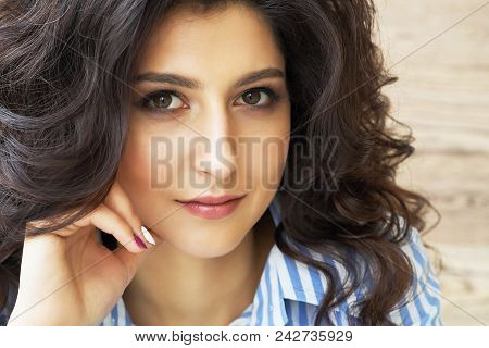 Girl With Long Curly Hair. Stylish Gorgeous Girl In The Luxury Beauty Salon. Beautiful Sexy Girl Wit