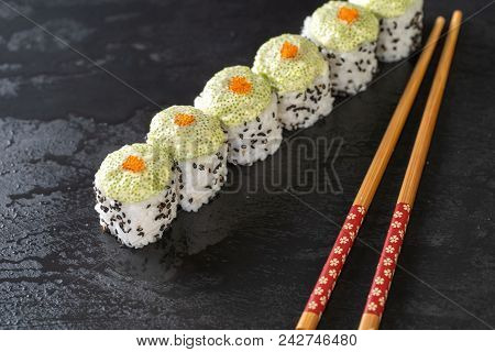 Close Up Of Sushi Rools Food On Black Stone Table