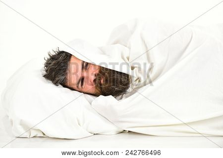 Guy With Beard Hides Under Blanket. Weekend Leisure Concept. Man Wants To Stay In Bed, Have Rest, Re