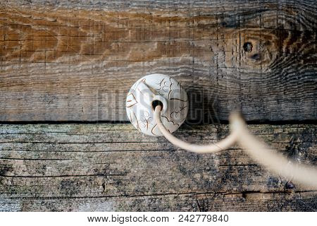 Japanese Philosophy Wabi Sabi Background. Dry Branch In Round Clay Vase On A Wooden Antique Textured
