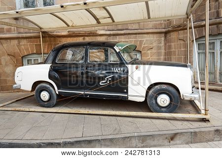 Tabriz, East Azerbaijan Province, Iran - March 15, 2018: Old Mercedes Benz Taxi Car Near Saat Tower,