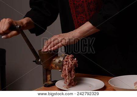 Woman Stirring Cooked Minced Meat In Kitchen.