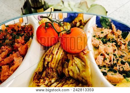 Healthy Typical Italian Tomato And Fresh Tuna With Aubergine Dish Ready To Be Eat On The Plate. Flor