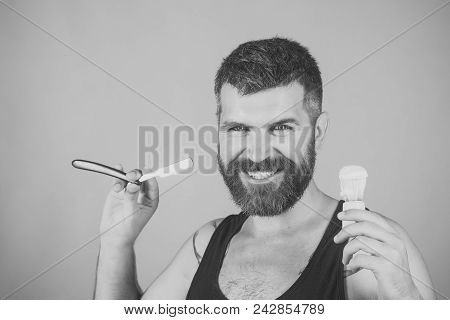 Fashion And Beauty, Innovation. Barber And Hairdresser. Man Cut Beard And Mustache With Razor And Sh