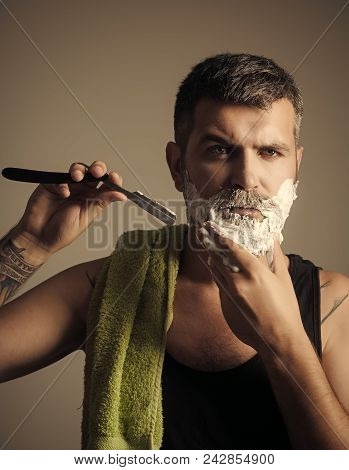 Man Cut Beard And Mustache With Razor And Shaving Brush. Serious Hipster In Barbershop, New Technolo