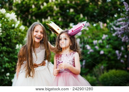 Lovely Sisters Made Of Cardboard Crowns And Play Princesses.