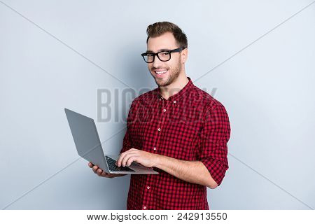 Portrait Of Excited Confident With Beaming Toothy Smile Wearing Red Checkered Shirt With Rolled-up S