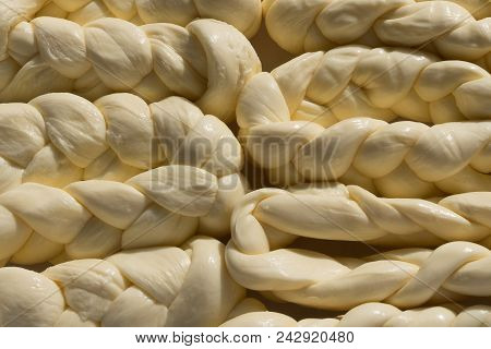 Cheese. Sulguni cheese. Suluguni. Background of suluguni cheese.