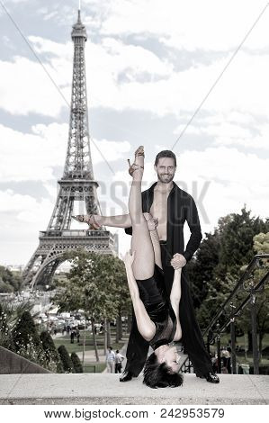 Dance Couple In Front Of Eifel Tower In Paris, France. Beatuiful Ballroom Dance Couple In Dance Pose