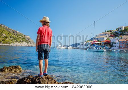 The Boy Looks At The Assos On The Island Of Kefalonia In Greece.