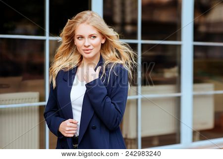 Young Beautiful Girl In Stylish Siut In The City