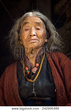 Prok Village / Nepal - October 14 2017. Portrait Of A Old Nepalese Woman In National Clothes In Her 