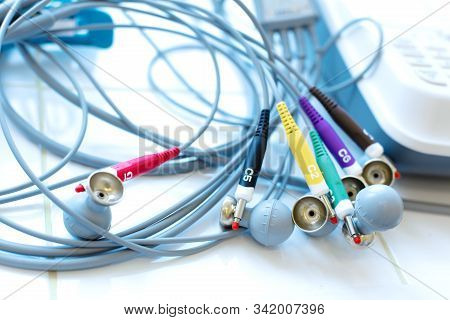 Electrode Suction Cup Sensors For Ecg Diagnostics, Lies On A White Tile In A Medical Room