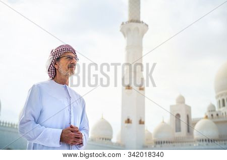 Arab Man Visiting The Grand Mosque In Abu Dhabi Wearing Kandora